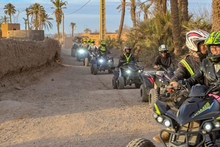 enjoying a quad bike Marrakech adventure and camel ride in the scenic Palmeraie desert landscape