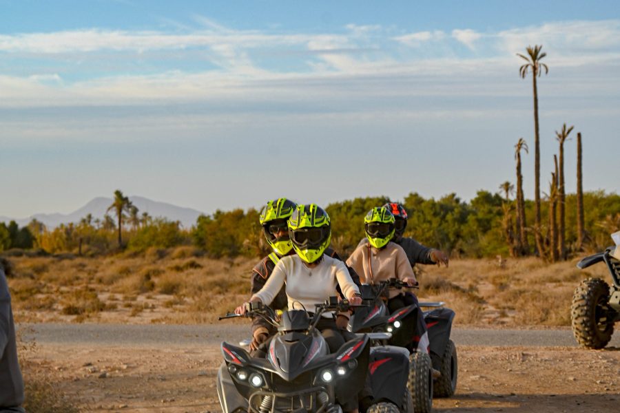 quad marrakech biking tour in the Palmeraie through desert trails surrounded by palm trees