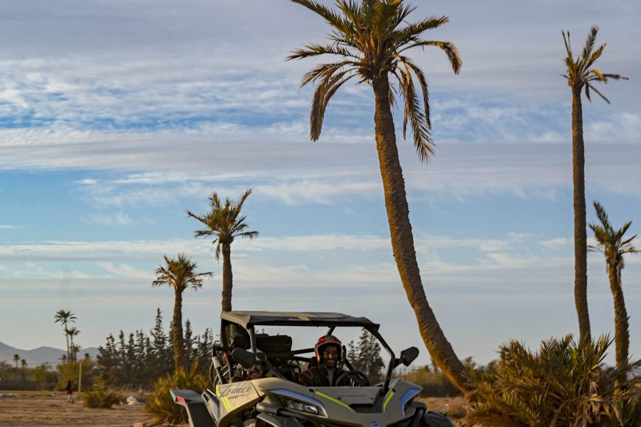 enjoying a buggy Marrakech desert ride through palm groves and rocky trails