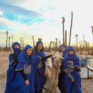 Camel ride through the Marrakech desert at sunset